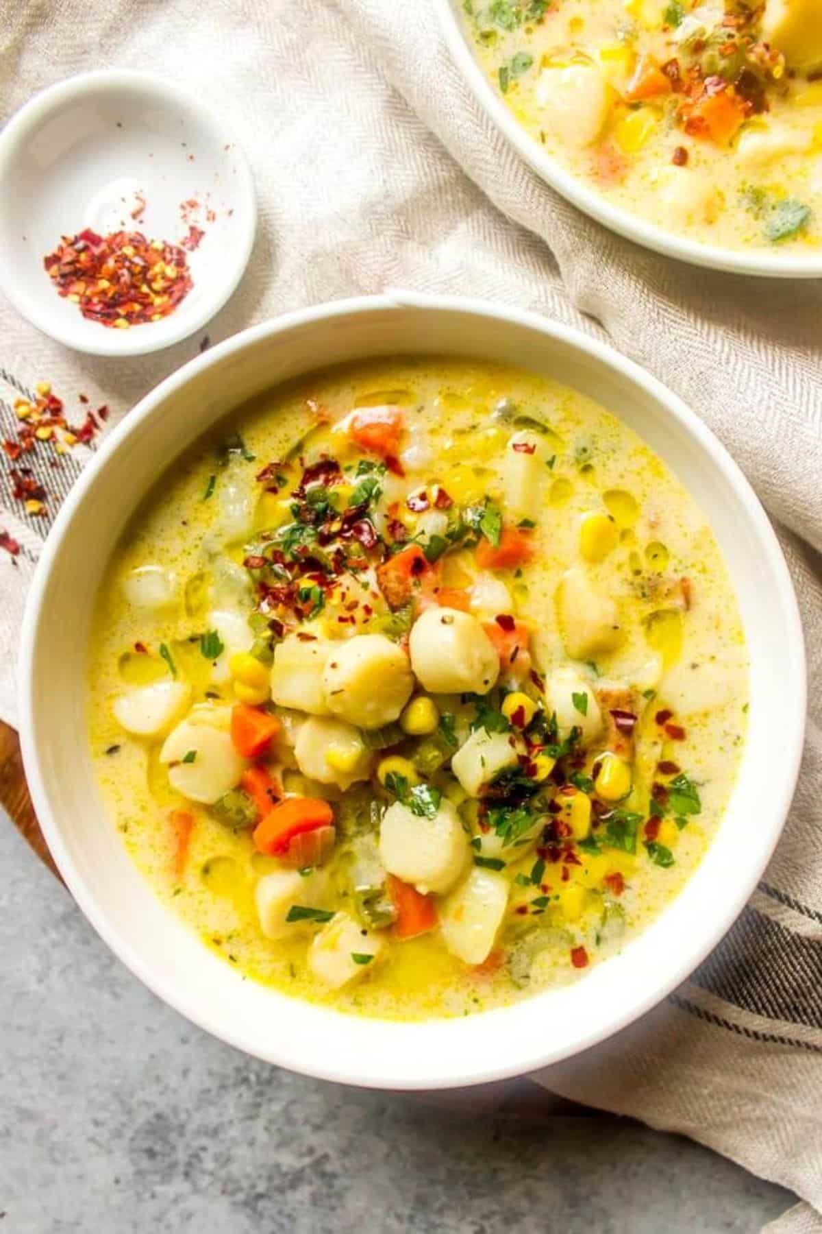 Creamy Scallop Chowder in a white bowl.