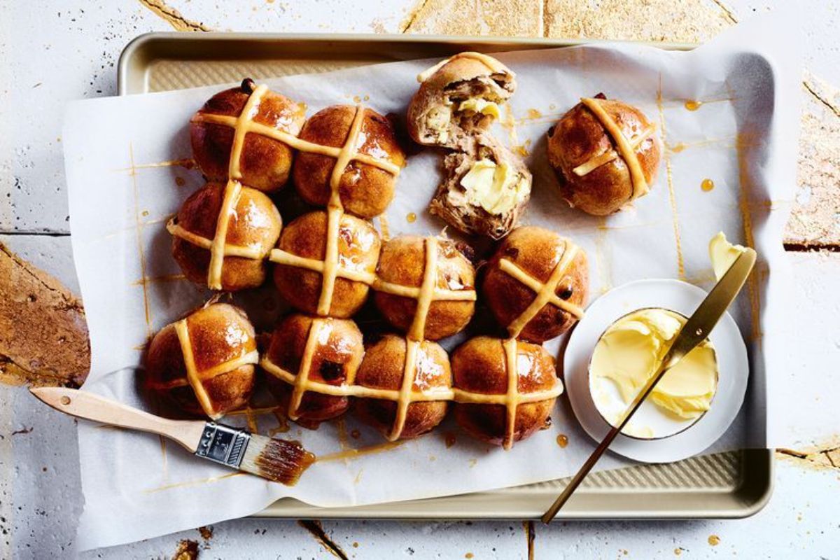 Flavorful Honey Cinnamon Hot Cross Buns on a tray.