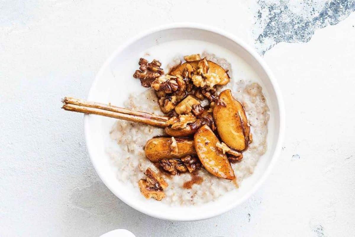 Scrumptious Cinnamon Apple Porridge in a white bowl.