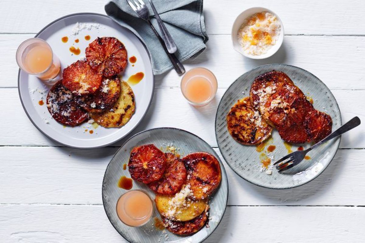 Delicious Bruleed Pancakes with Ruby Grapefruit on plates.