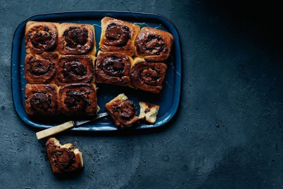 Scrumptious White Chocolate, Blueberry, and Honey Buns on a tray.