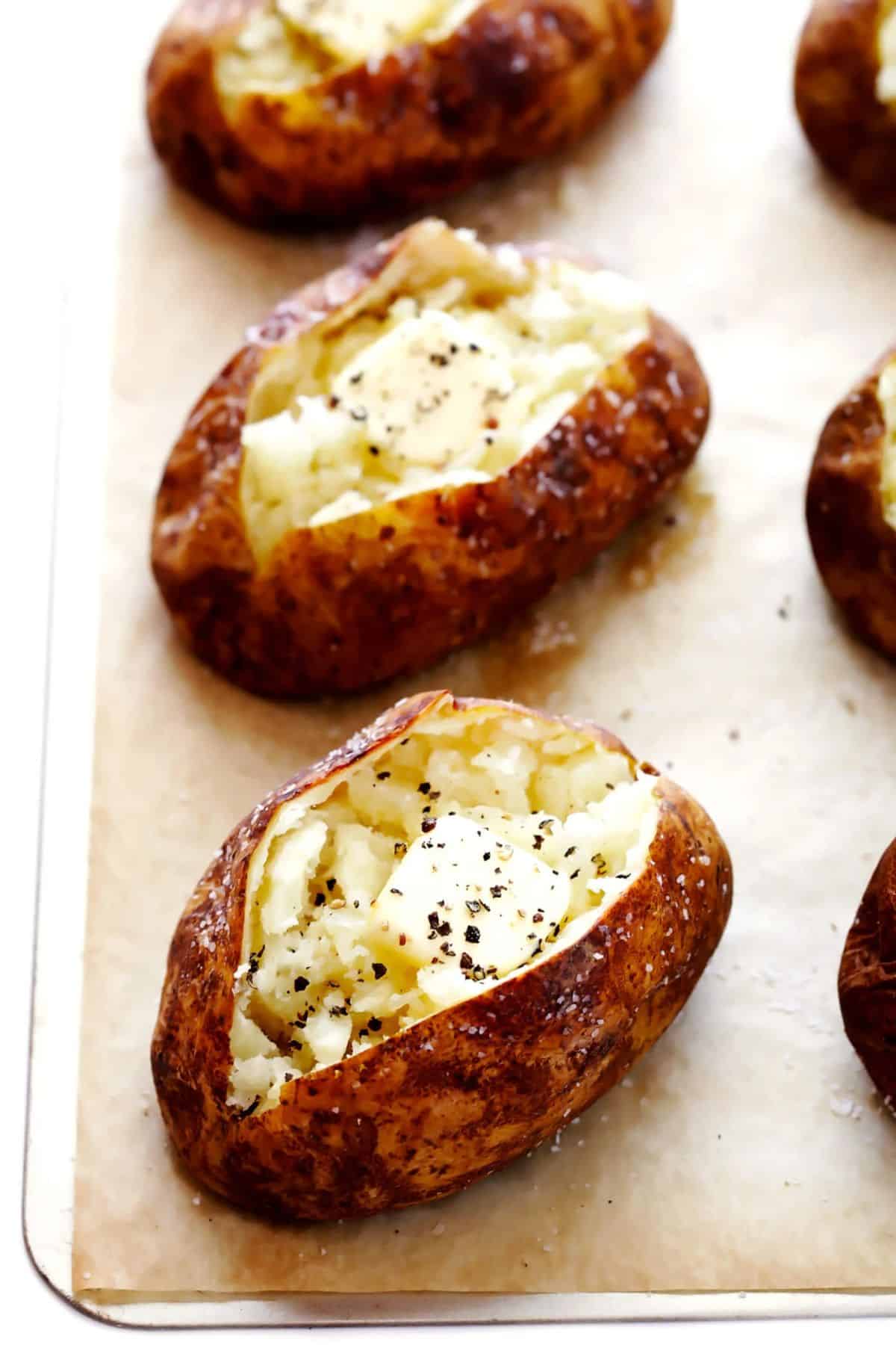 Delicious Classic Baked Potatoes on a tray.
