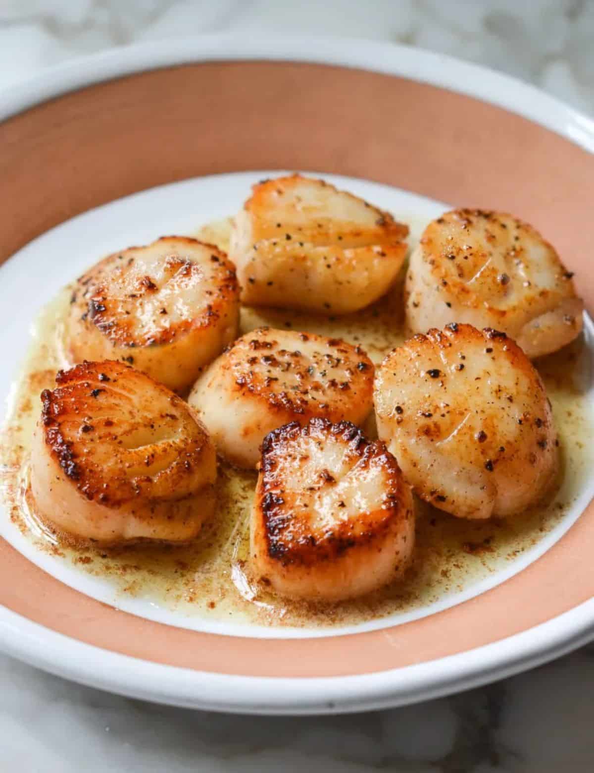 Scrumptious Pan-Seared Scallops with Lemon Butter in a bowl.