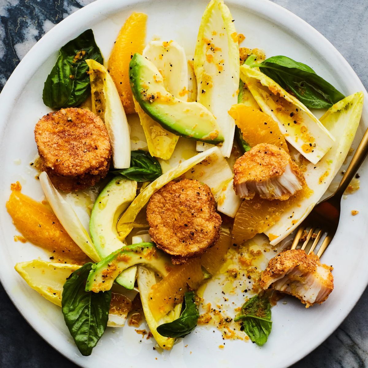 Healthy Crispy Scallop Saladon a white tray with a fork.