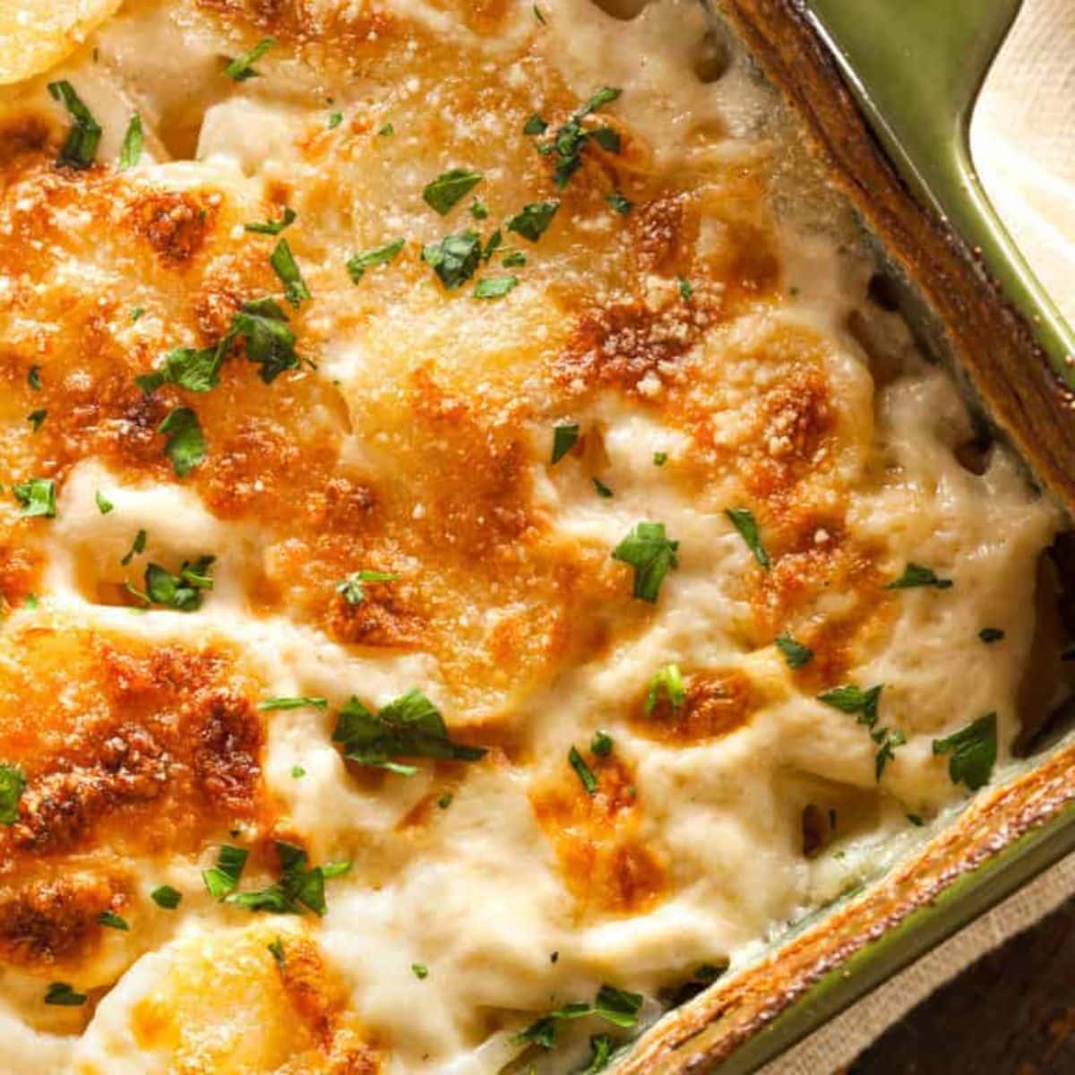 Juicy Perfect Au Gratin Potatoes in a casserole.