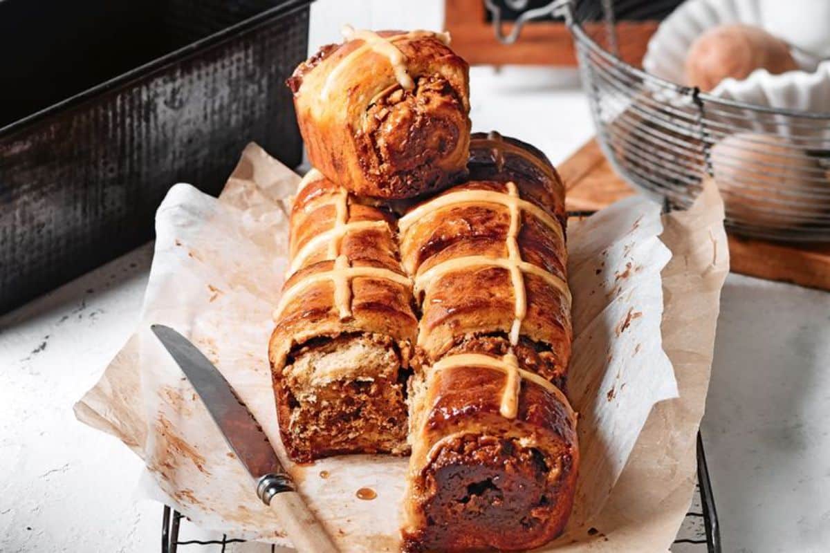 Scrumptious Dulce de Leche and Pear Hot Cross Bun Pull-apart Loaf on a resting grid.