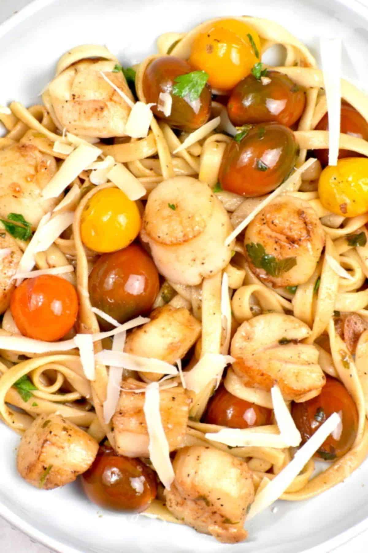 Fresh Scallop Pasta with Cherry Tomatoes on a white tray.